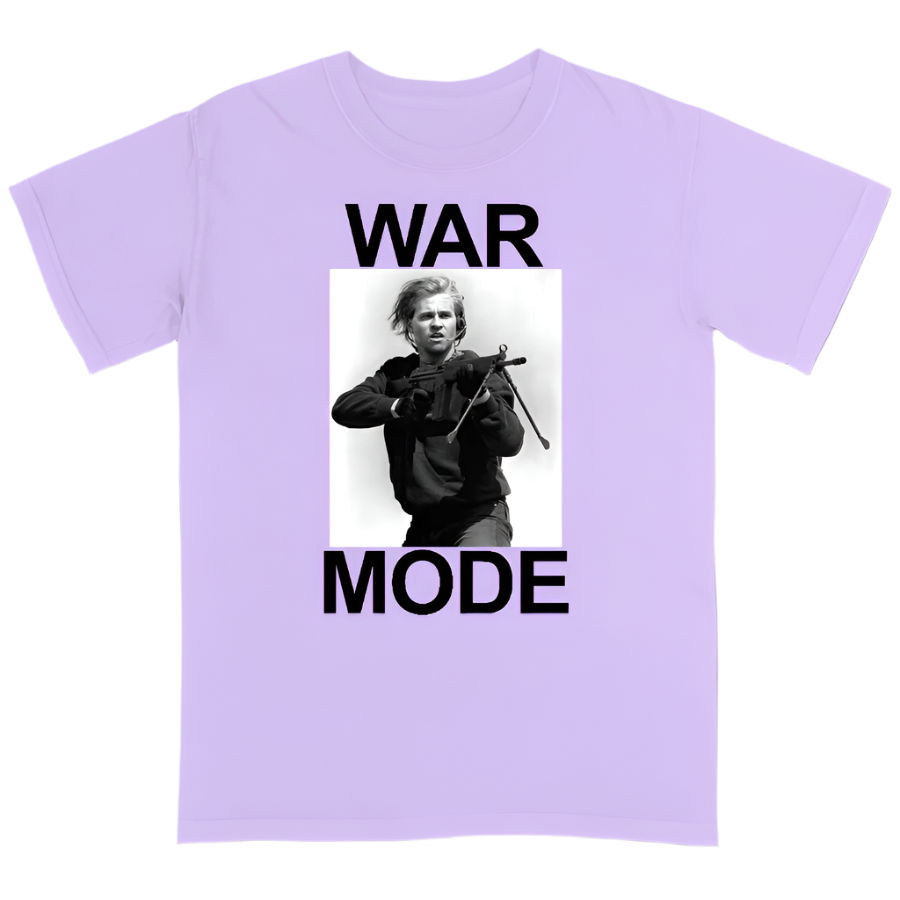 White t-shirt with a graphic of a person holding a rifle and text 'WAR MODE' on a light purple background